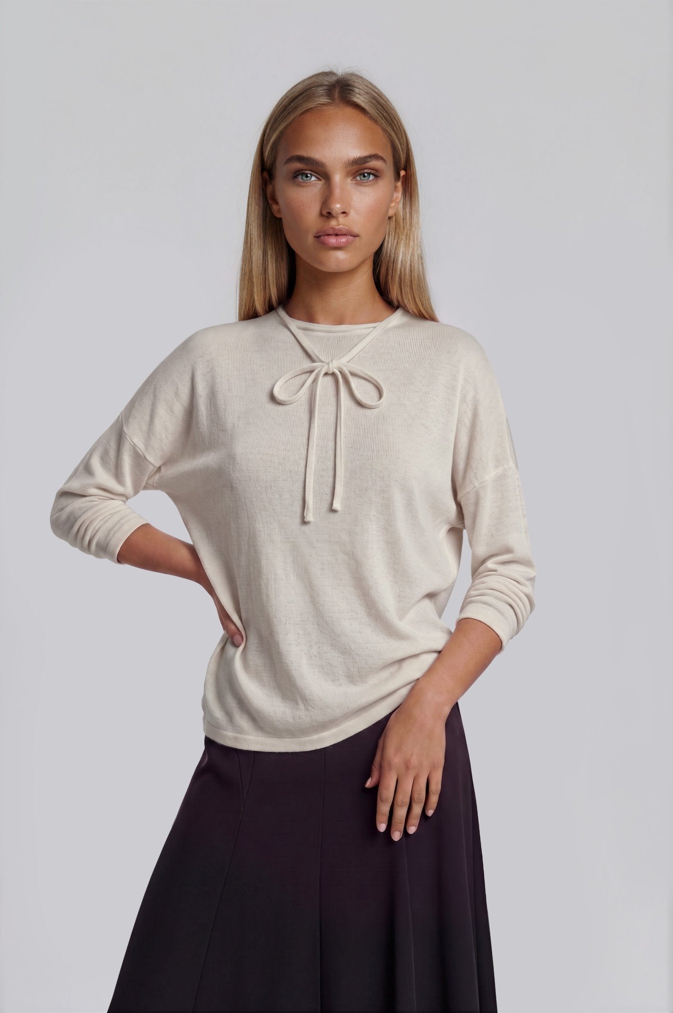 Oatmeal heather long sleeve knit sweater top with tie bow neck.