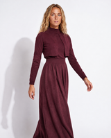 Burgundy knit mock-neck top with long sleeves and gathered maxi skirt