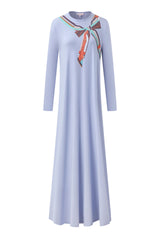 Soft blue long-sleeve nightgown with a colorful scarf-print neckline and flowing floor-length skirt