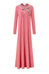 Pink long-sleeve nursing nightgown with a colorful scarf-print bow at the neckline