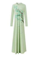 Long-sleeve nightgown in pale green with a floor-length skirt and flowering tree print