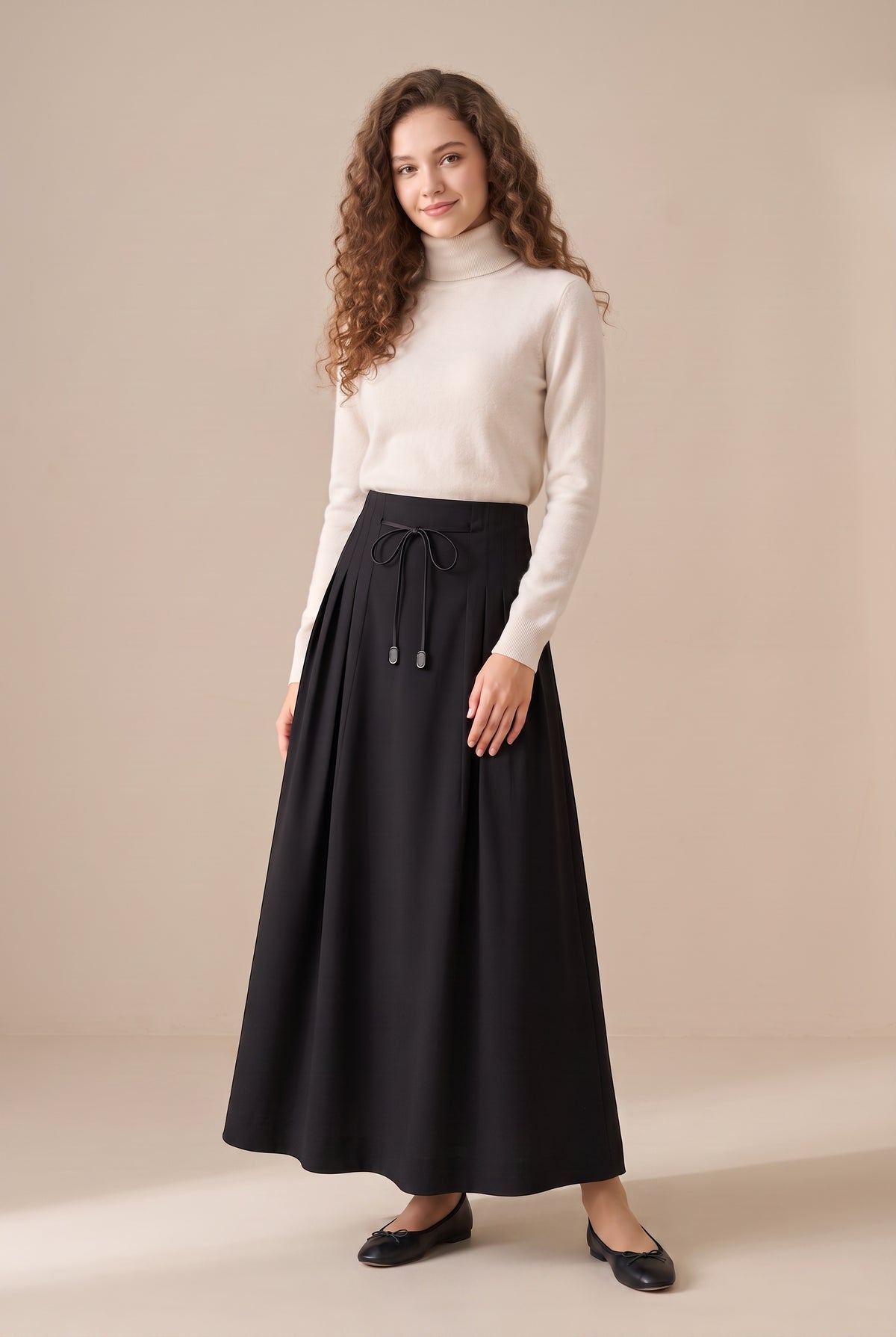 Black drawstring maxi skirt with elastic waist and full gathered shape