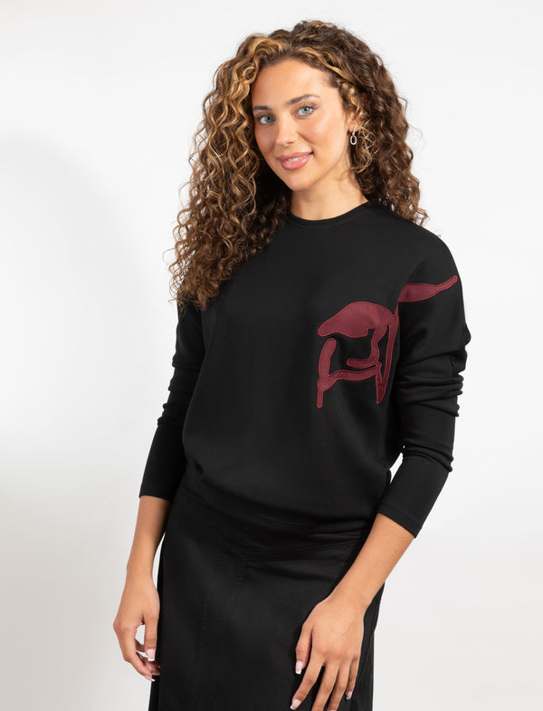 Black Long-Sleeve Top With Burgundy Design On The Left Side