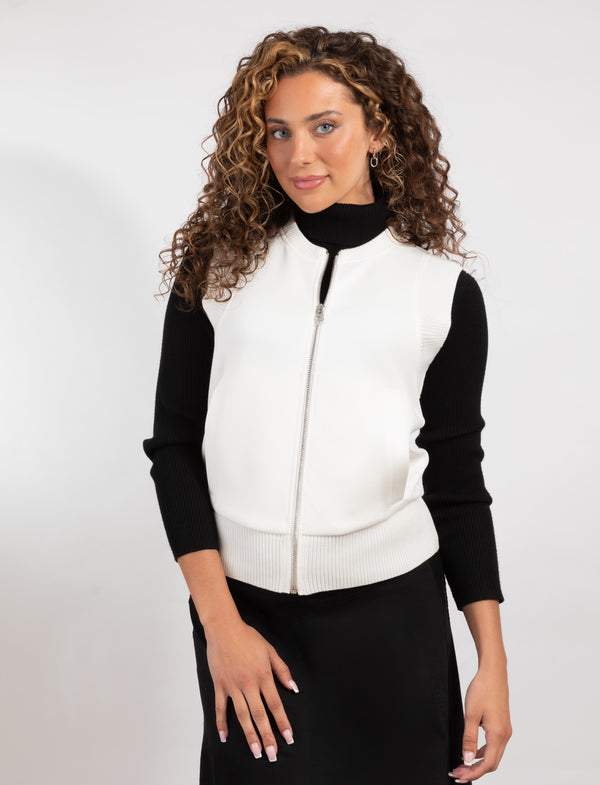 Zip-Front Ivory Vest With A Sleek Fit And Cozy Pockets