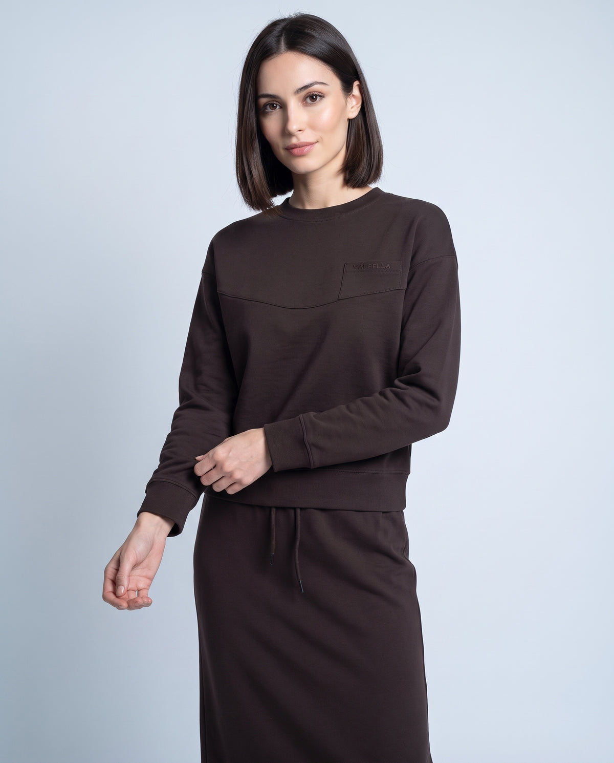 Brown crewneck sweatshirt with front patch pocket and long sleeves
