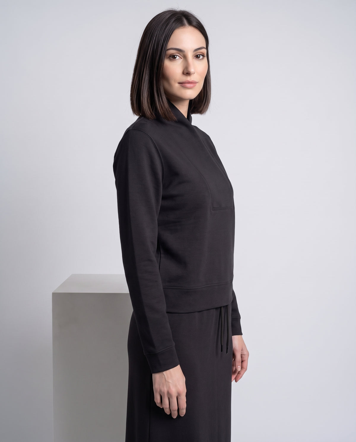 Dark side-view shawl-neck pullover with long sleeves and front pocket
