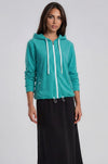 Dark Green Terry Zip Hoodie with drawstring and pockets worn with black terry A-line midi skirt.