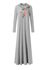 Heather gray nightgown with long sleeves, floor-length A-line skirt, and colorful scarf print at the neck