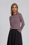 Pink and black striped long sleeve tee shirt top.