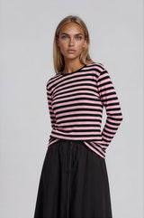 Pink and black striped long sleeve tee shirt top.