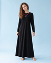 Black nursing nightgown with long sleeves, a full-length skirt and contrast trim at the neckline.