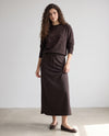 Dark brown crewneck sweatshirt with scattered rhinestones and ribbed hem, long sleeves