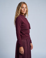 Burgundy layered knit sweater and flowy maxi skirt outfit, mock neck and long sleeves