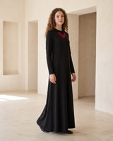 Black nursing nightgown with red V-neck trim, long sleeves, and a floor-length flared silhouette