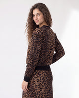 Leopard print sweatshirt side view with crew neckline and ribbed waistband and cuffs